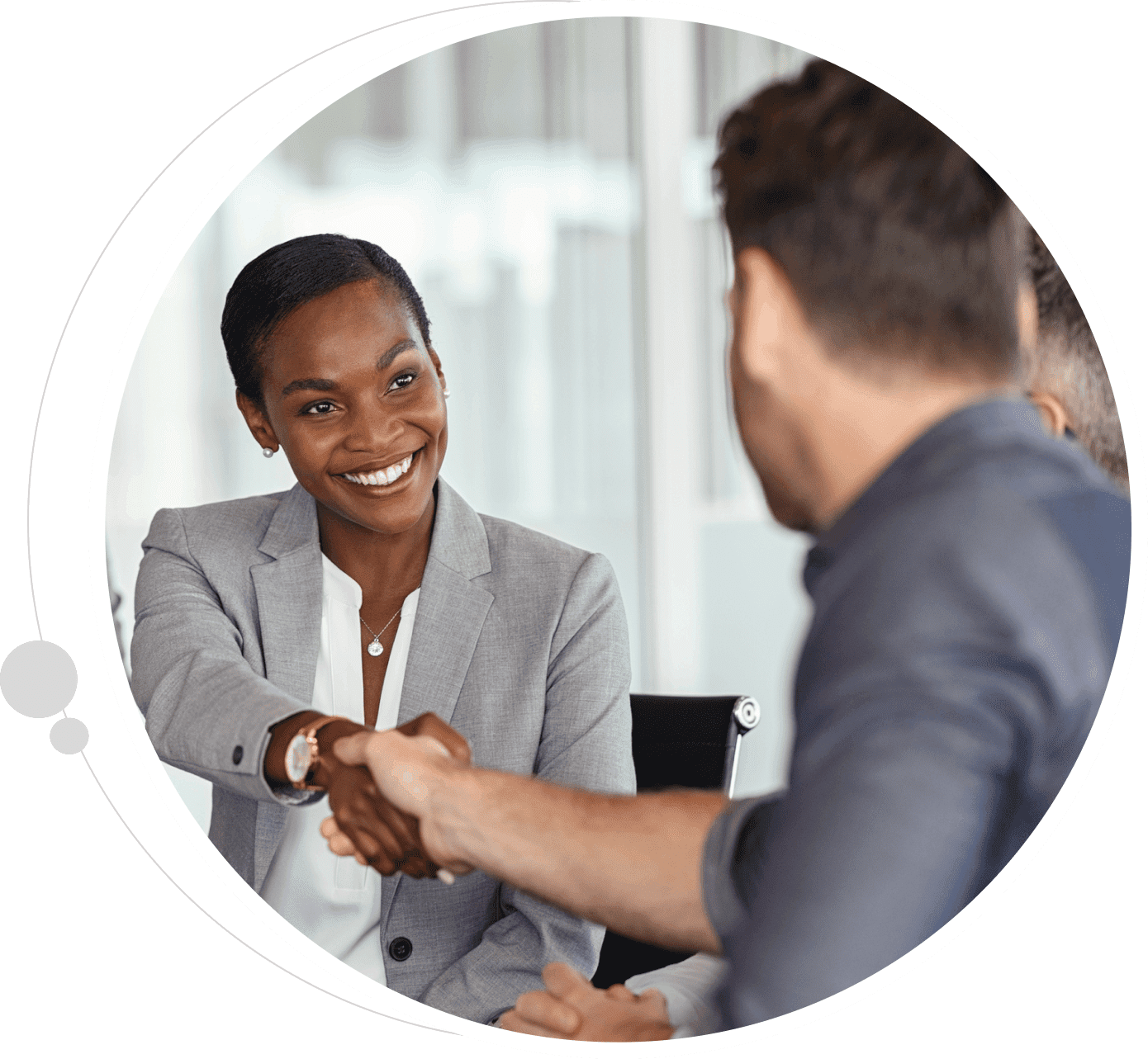 Two people shaking hands in a circle.
